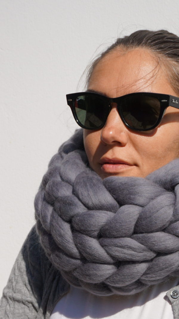 girl wearing a granite grey arm knitted chunky knit infinity cowl merino wool scarf