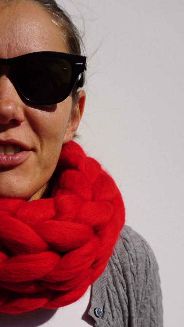 girl wearing a scarlet red chunky knit infinity cowl merino wool scarf